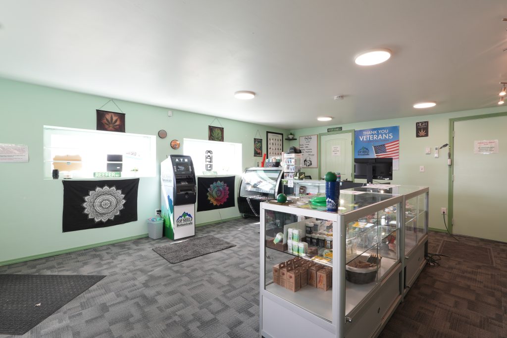 Interior of Three Forks dispensary, featuring premium cannabis products like flower, concentrates, edibles, and accessories.