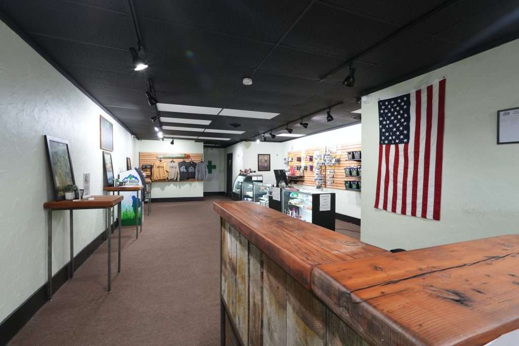 Interior of dispensary in Ennis MT Top Shelf Botanicals, featuring premium cannabis products like flower, concentrates, edibles, and accessories.