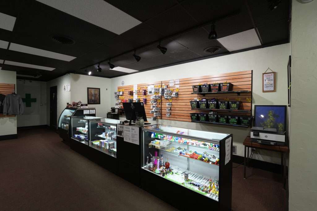 Interior of dispensary in Ennis MT Top Shelf Botanicals, featuring premium cannabis products like flower, concentrates, edibles, and accessories.