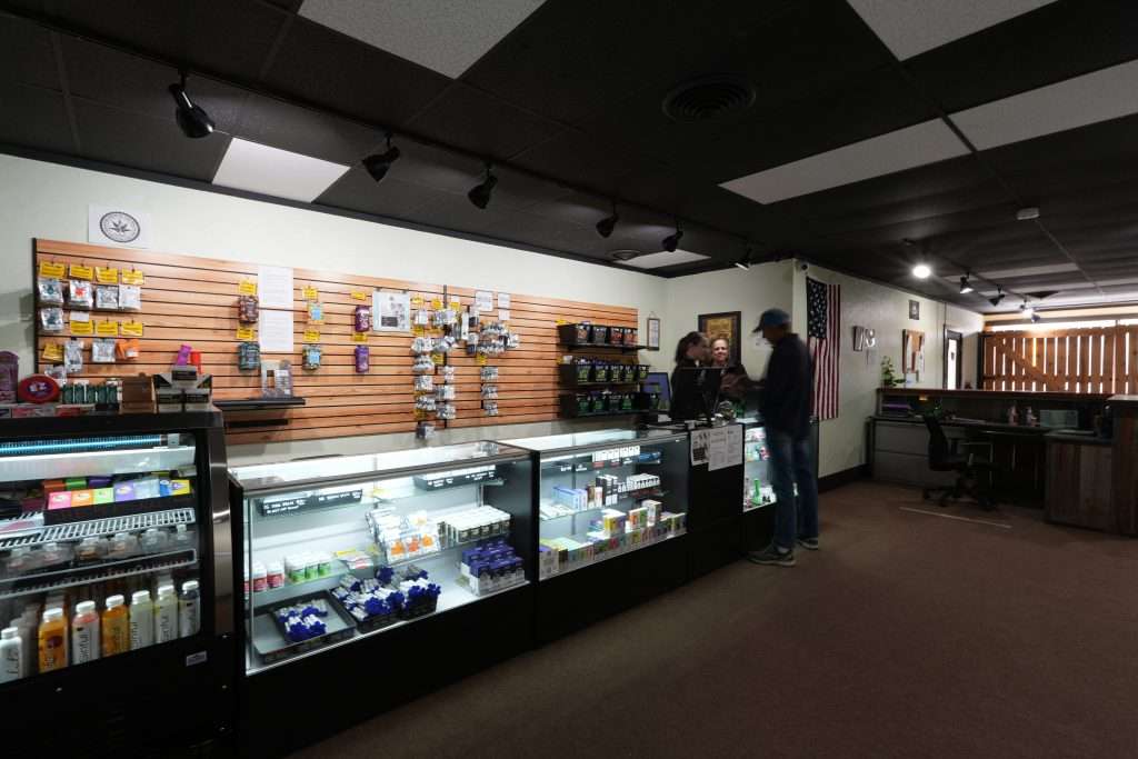 Interior of dispensary in Ennis MT Top Shelf Botanicals, featuring premium cannabis products like flower, concentrates, edibles, and accessories.