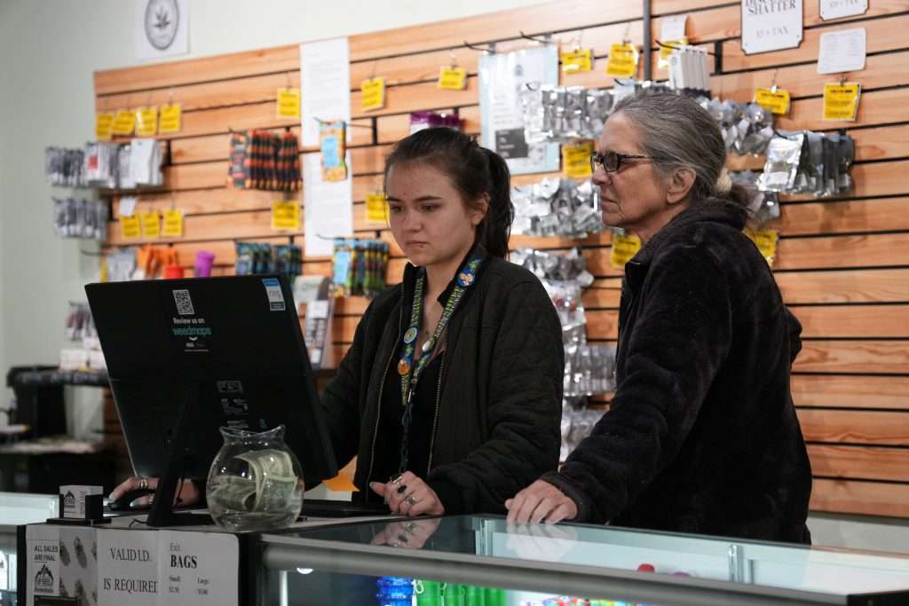 Interior of dispensary in Ennis MT Top Shelf Botanicals, featuring premium cannabis products like flower, concentrates, edibles, and accessories.