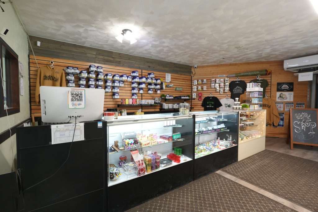 Interior of Sheridan dispensary, featuring premium cannabis products like flower, concentrates, edibles, and accessories.
