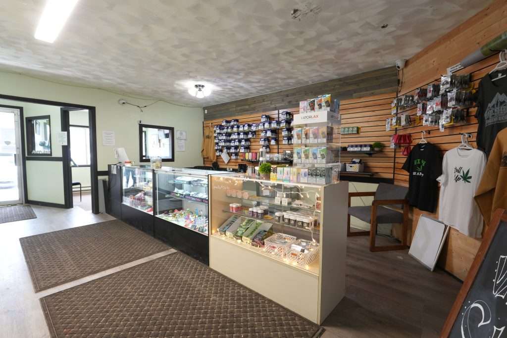 Interior of Sheridan dispensary, featuring premium cannabis products like flower, concentrates, edibles, and accessories.
