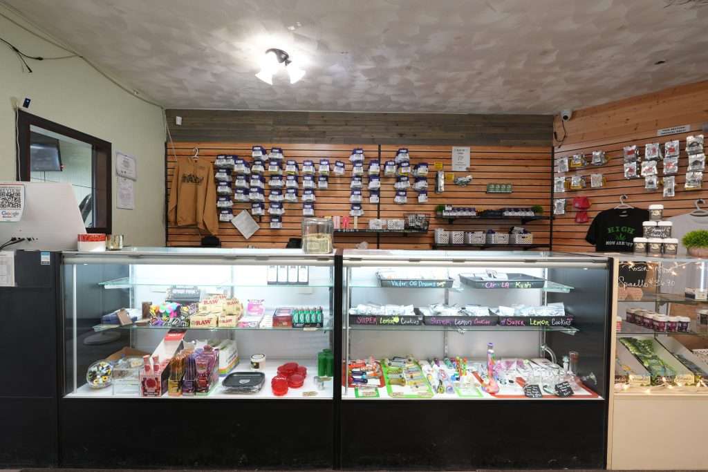 Interior of Sheridan dispensary, featuring premium cannabis products like flower, concentrates, edibles, and accessories.