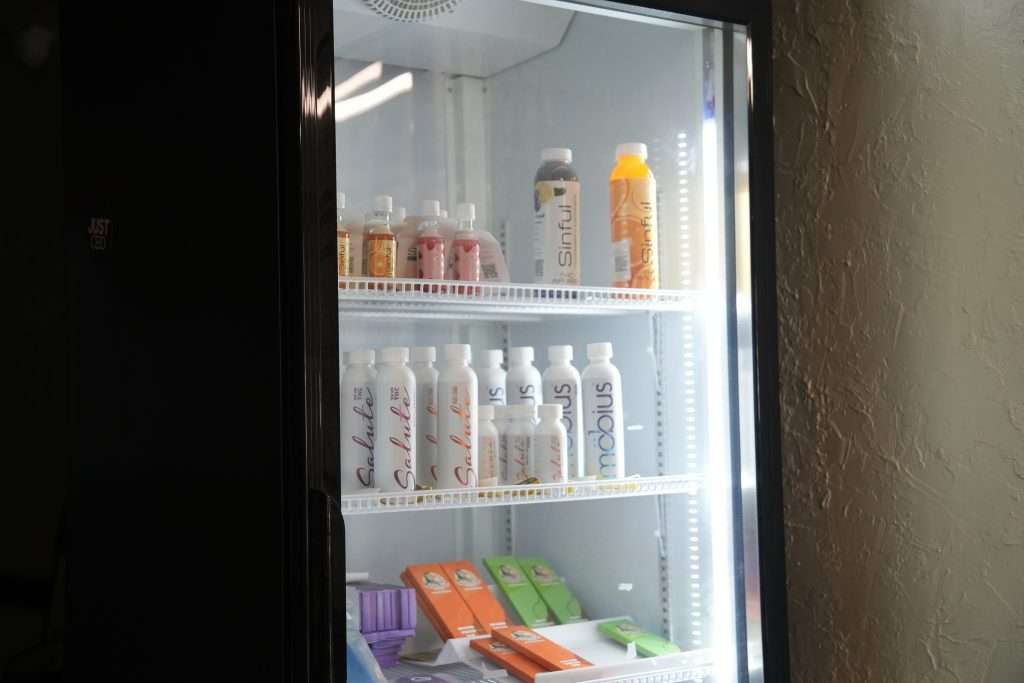 Interior of Sheridan dispensary, featuring premium cannabis products like flower, concentrates, edibles, and accessories.