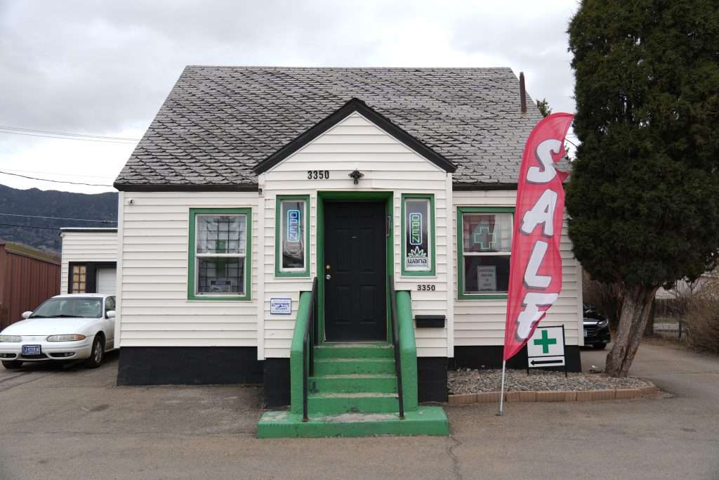 Exterior view of the dispensary in Butte MT, Top Shelf Botanicals, showcasing the store front and inviting entrance.
