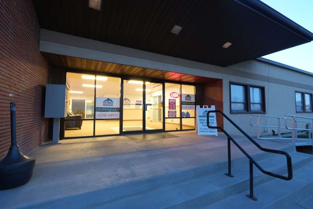 Exterior view of the best dispensary in Great Falls, Top Shelf Botanicals, showcasing the store front and welcoming entrance.