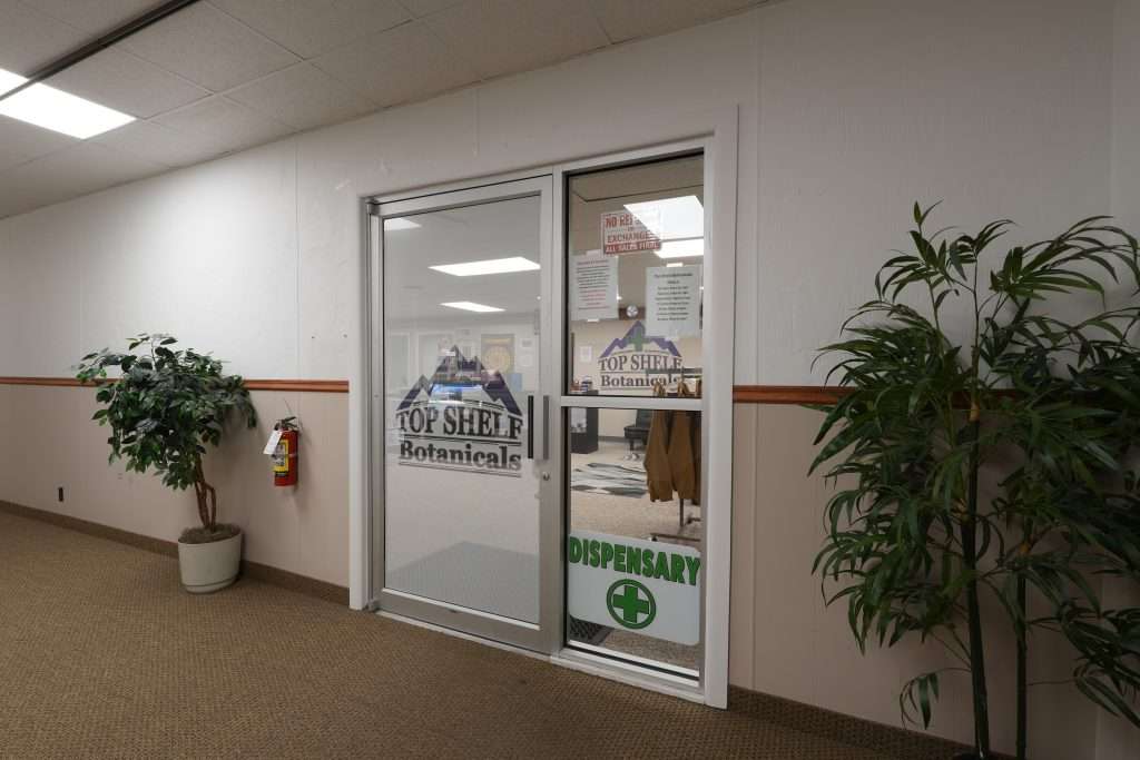 Exterior view of the best dispensary in Great Falls, Top Shelf Botanicals, showcasing the store front and welcoming entrance.