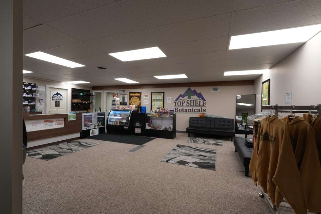Interior of the best dispensary in Great Falls, Top Shelf Botanicals, featuring premium cannabis products like flower, concentrates, edibles, and accessories.