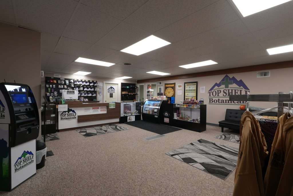Interior of the best dispensary in Great Falls, Top Shelf Botanicals, featuring premium cannabis products like flower, concentrates, edibles, and accessories.