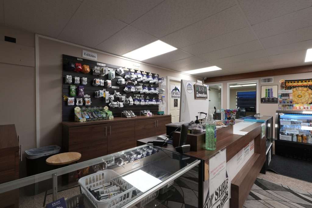 Interior of the best dispensary in Great Falls, Top Shelf Botanicals, featuring premium cannabis products like flower, concentrates, edibles, and accessories.