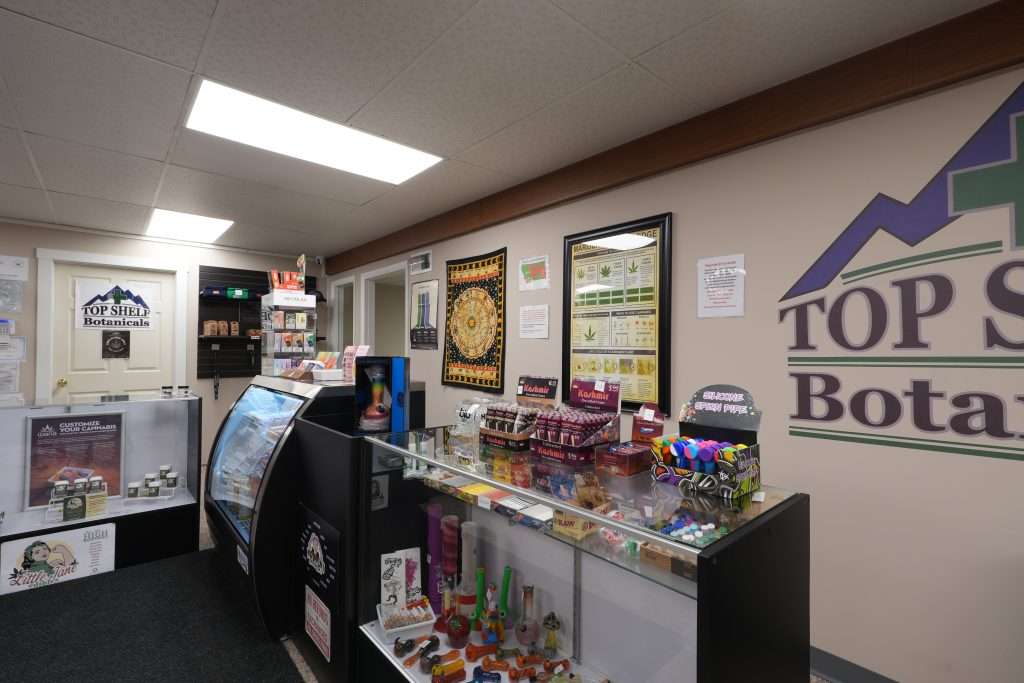 Interior of the best dispensary in Great Falls, Top Shelf Botanicals, featuring premium cannabis products like flower, concentrates, edibles, and accessories.