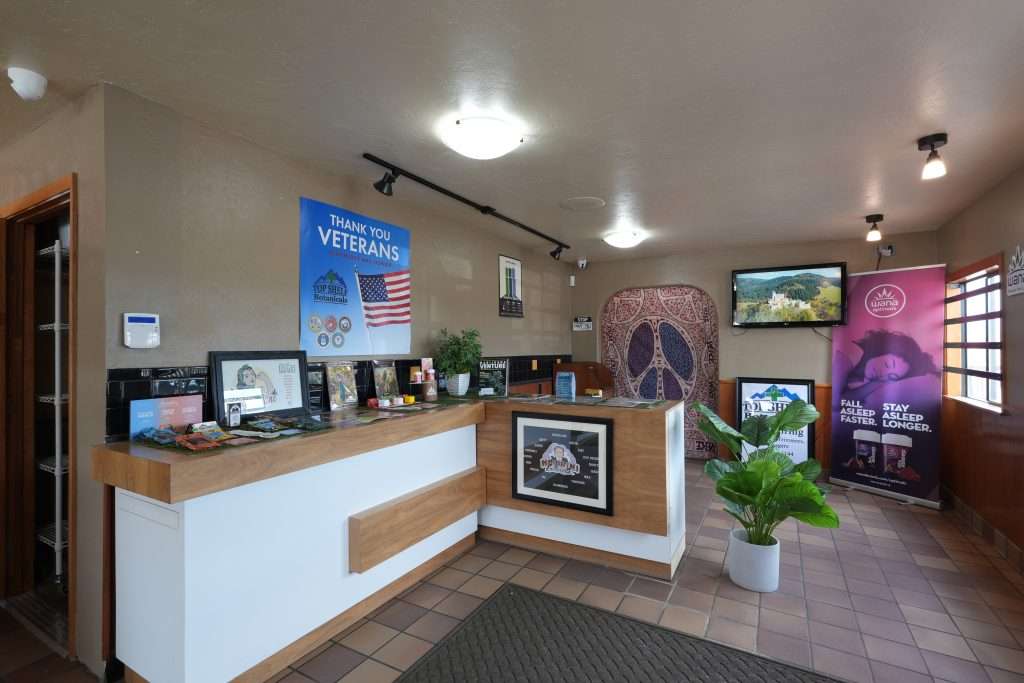 Interior of Missoula dispensary on Broadway, featuring premium cannabis products like flower, concentrates, edibles, and accessories.