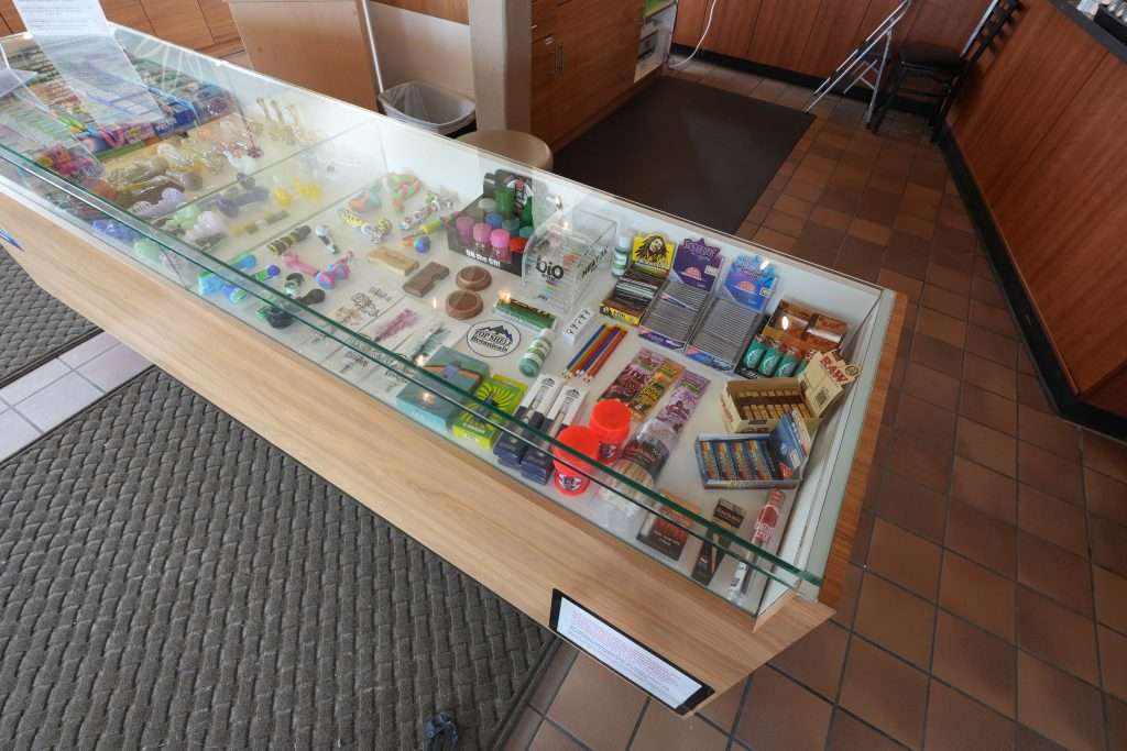 Interior of Missoula dispensary on Broadway, featuring premium cannabis products like flower, concentrates, edibles, and accessories.
