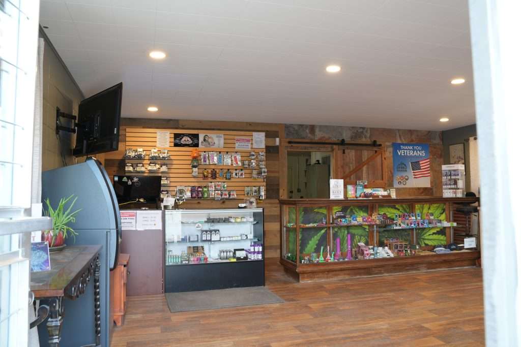 Interior of Arlee dispensary, featuring premium cannabis products like flower, concentrates, edibles, and accessories.