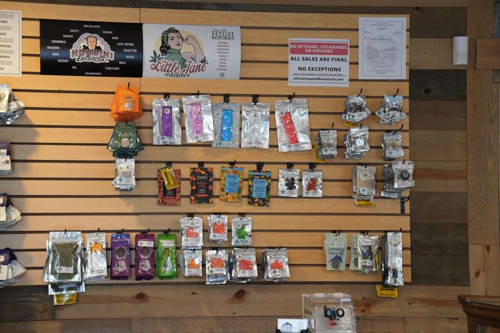 Interior of Arlee dispensary, featuring premium cannabis products like flower, concentrates, edibles, and accessories.