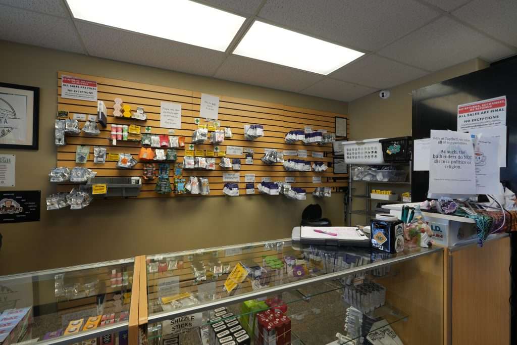 Interior of Plains dispensary, featuring premium cannabis products like flower, concentrates, edibles, and accessories.