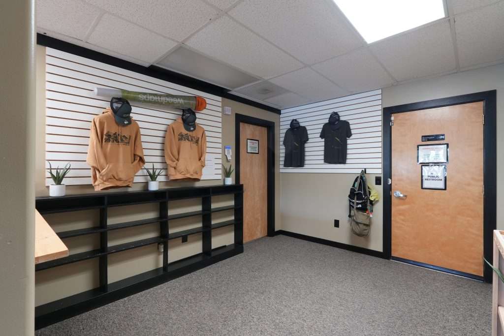 Interior of Plains dispensary, featuring premium cannabis products like flower, concentrates, edibles, and accessories.