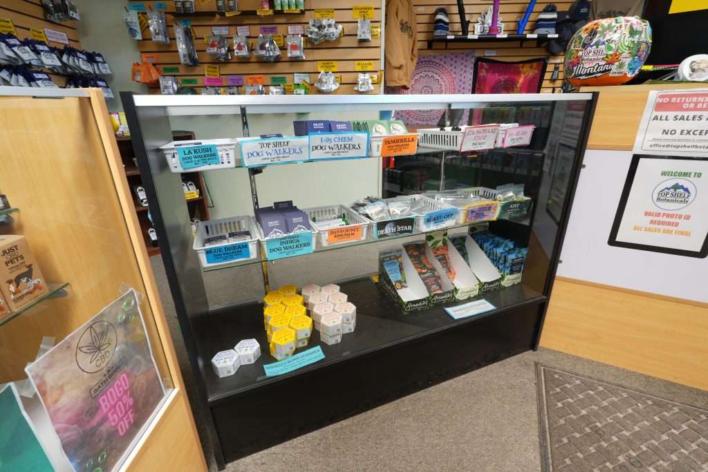Interior of Polson dispensary, featuring premium cannabis products like flower, concentrates, edibles, and accessories.